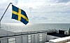 Svensk flagga på fartyg.